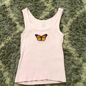 White tank with orange and yellow butterfly patch